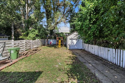 A fenced backyard and detached 1-car garage