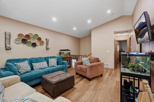 Living Room with newer flooring & recessed lighting