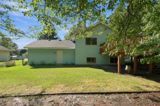 Fully Fenced in Backyard with Deck and Service Door to the Garage