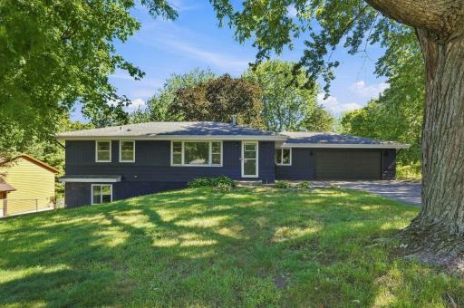 Photo for 14925 Deerwood Drive, Burnsville, MN 55306 - listing #7141800 Front Exterior — Walkout rambler set among mature trees on a spacious .31-acre lot.
