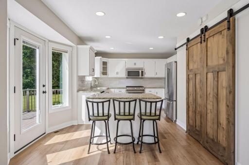 Kitchen has been updated with new flooring and backsplash!