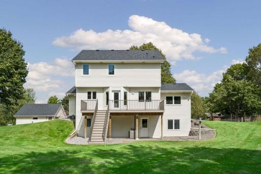 Low maintance deck with stairs leading to the backyard.