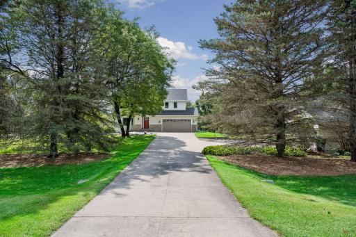 The driveway is extended to lead to the additional 2 car detached garage.