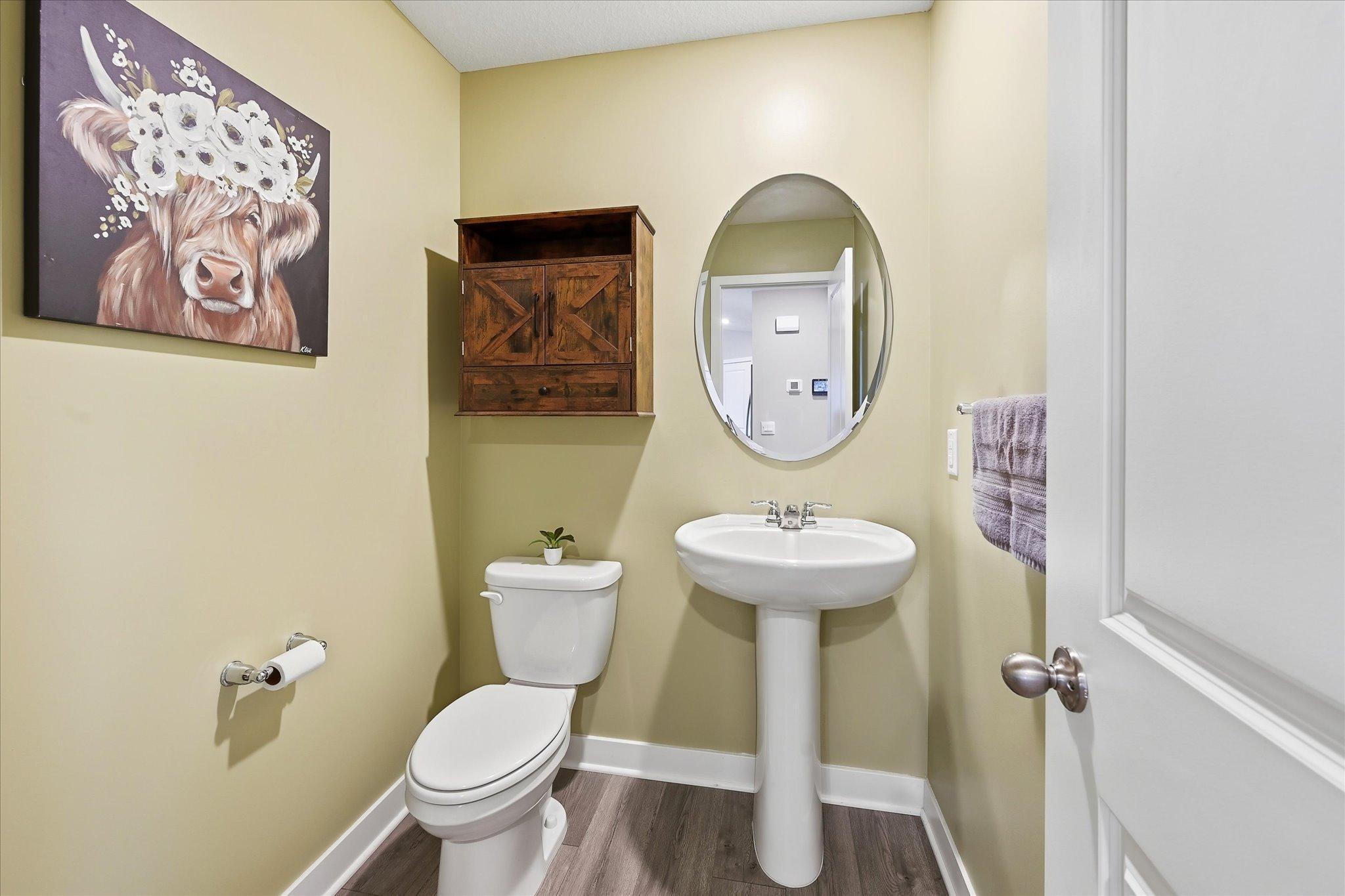 A conveniently located half bath completes the main living level.