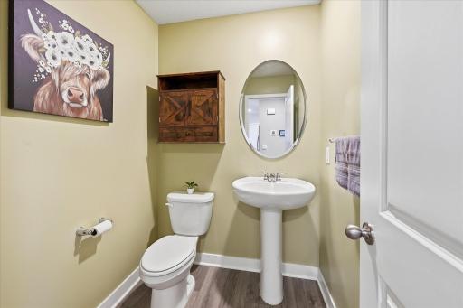 A conveniently located half bath completes the main living level.