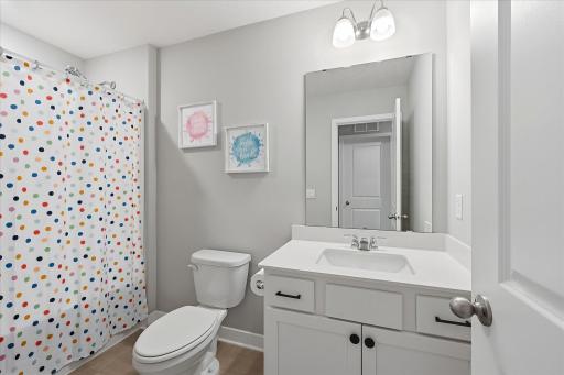 An additional full bath adds convenience to the lower-level living area.