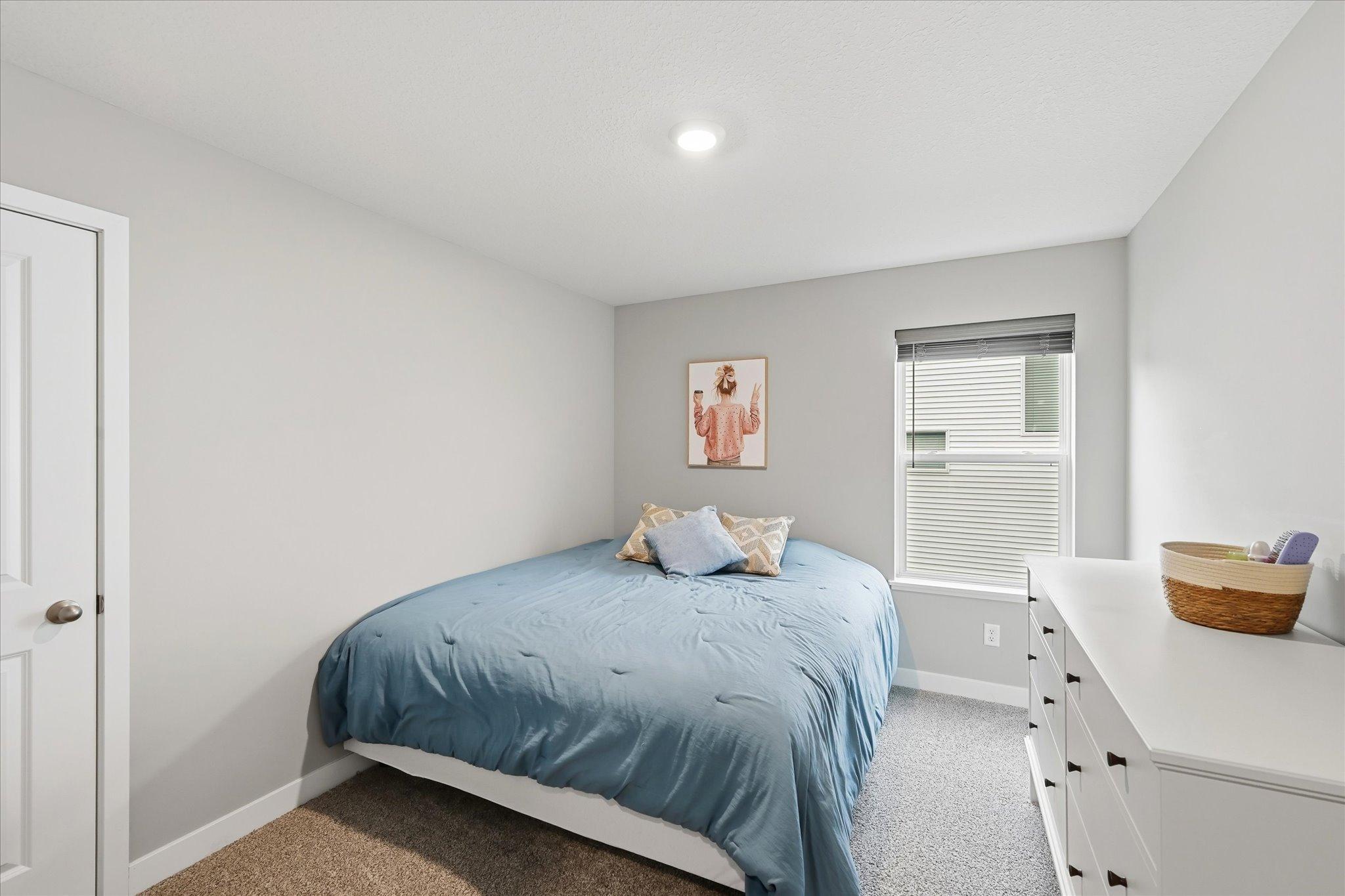 Upper level bedroom #2 with walk in closet.