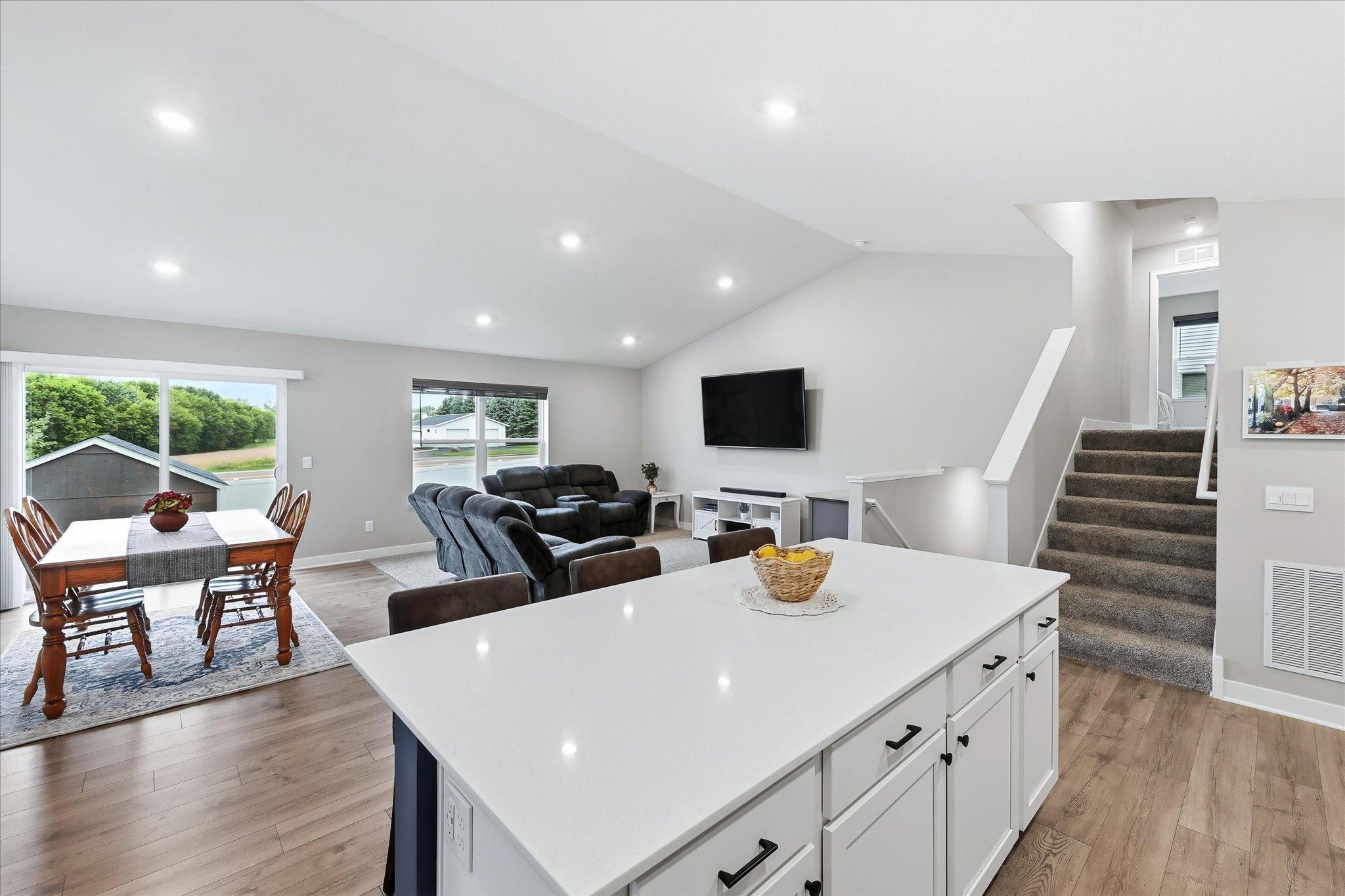 An open-concept design connects the kitchen, dining, and living areas, making everyday living and entertaining effortless.