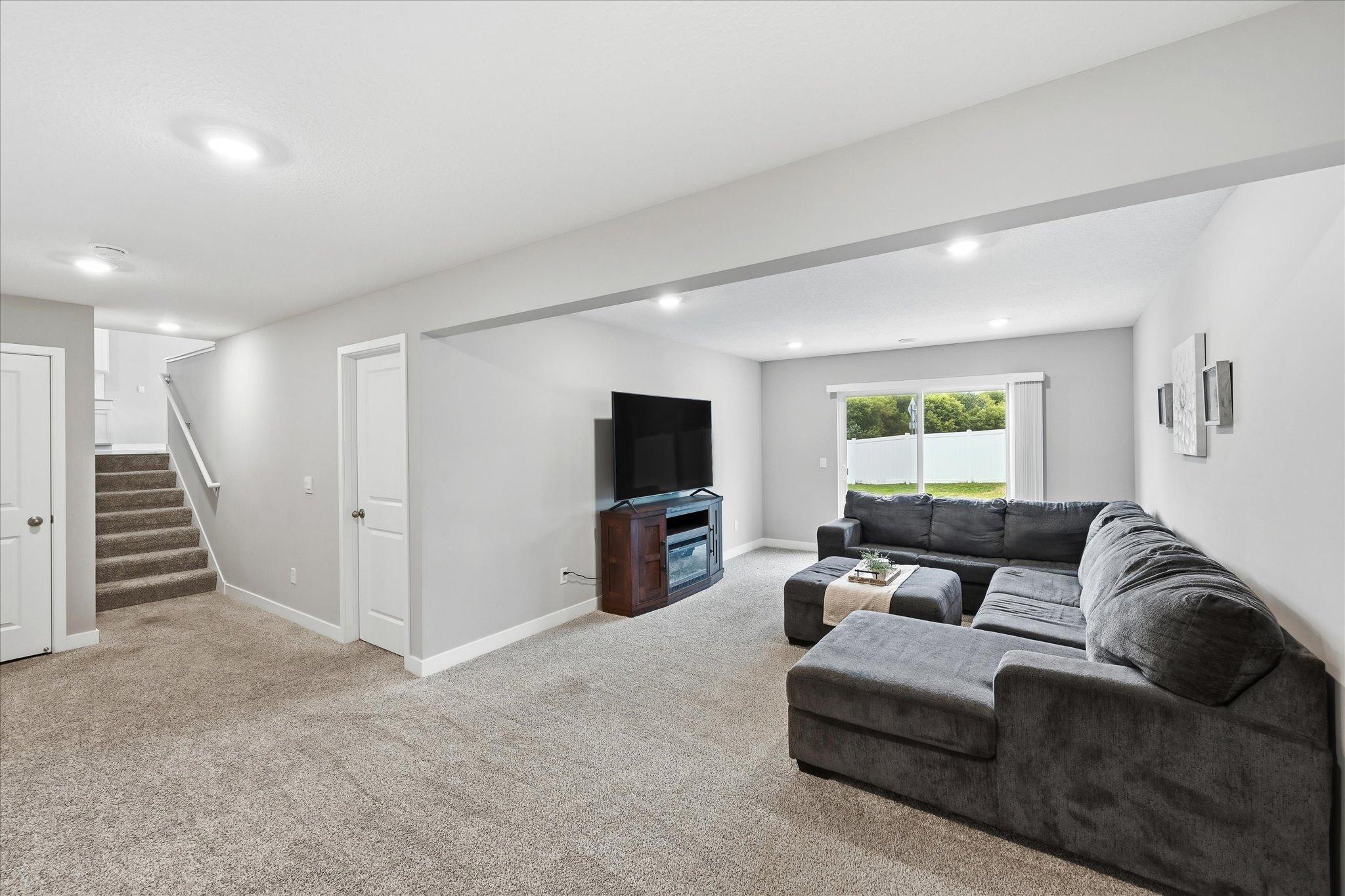 Head downstairs and discover even more room to relax, entertain, or spread out. Walkout access to the patio and backyard.