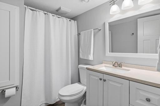 Updated basement bath is located between the bedroom and family room.