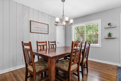 The eat in kitchen area fits a large table.