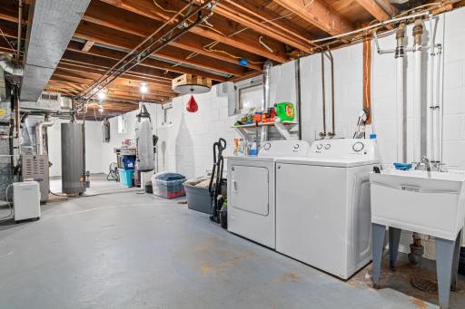 The laundry room is very spacious and provides lots of storage.