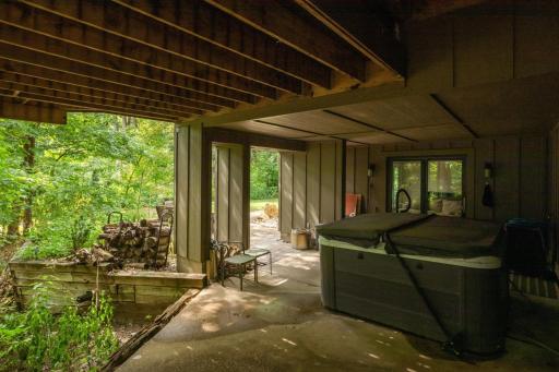 Patio with hot tub on the lower level