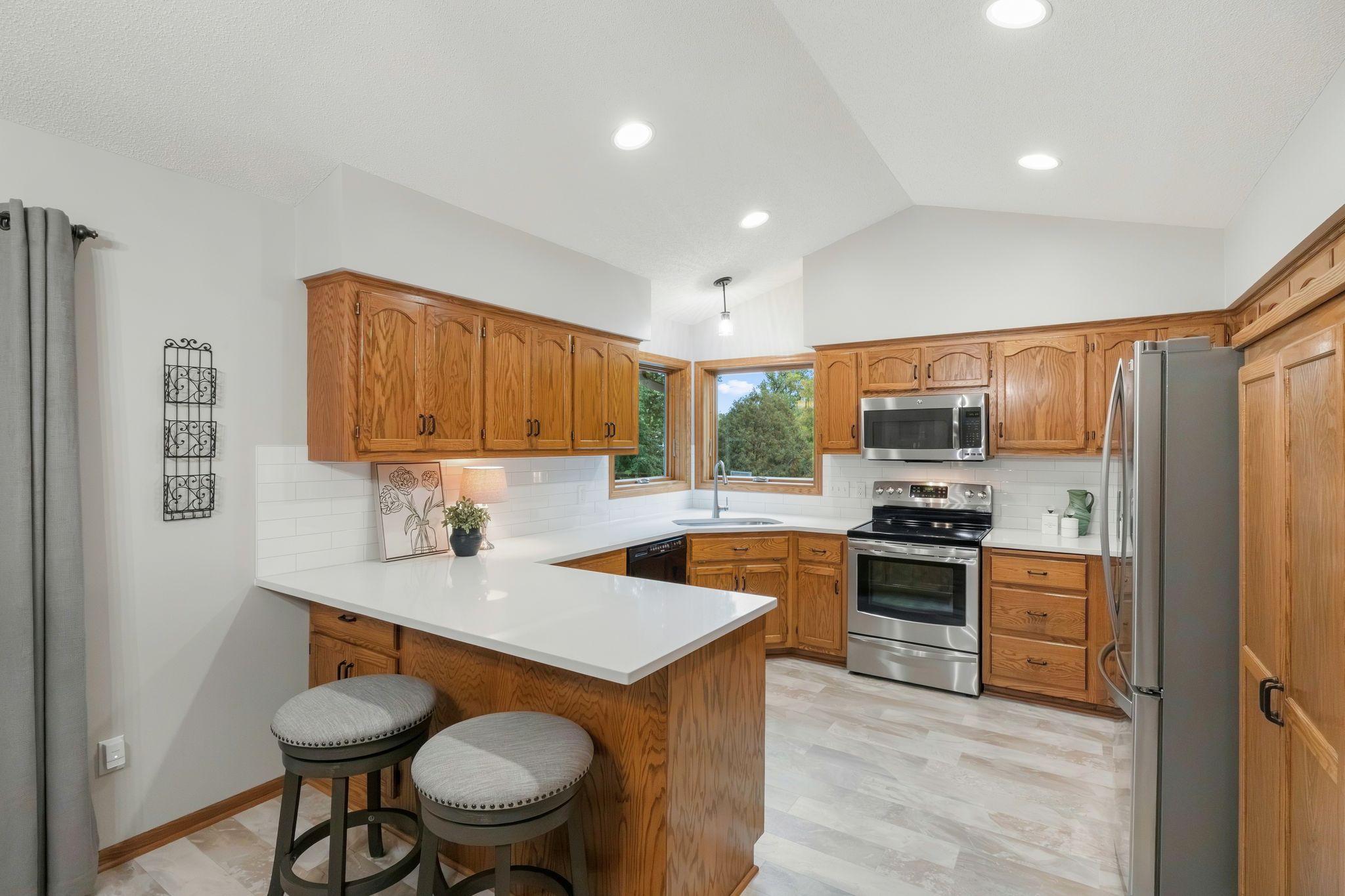 Kitchen refresh in 2025 - new countertops, backsplash and flooring.
