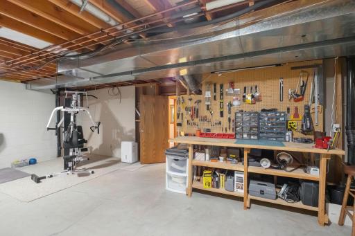 Wonderful workbench space and enough room exercise equipment