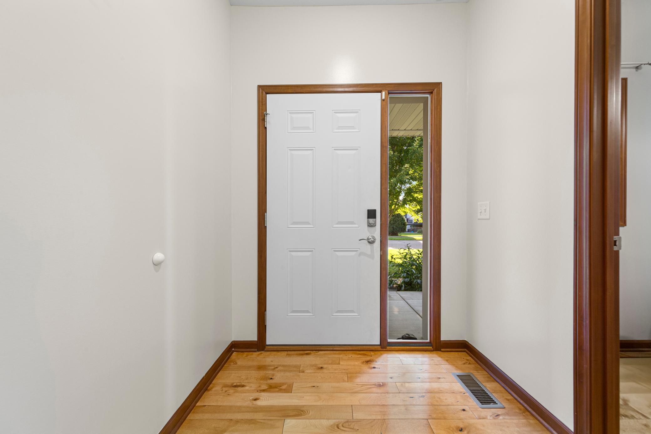 12_Step onto gorgeous wood floors at the entry.jpg