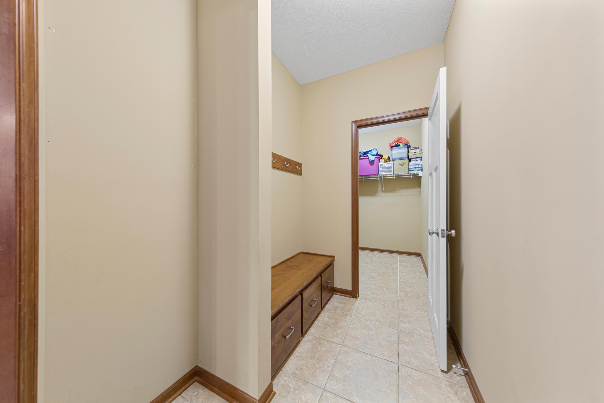 46_Mudroom built-in drop zone and large walk-in closet.jpg
