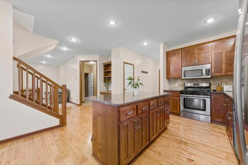 22_Kitchen with Alder cabinetry, granite counters, and center island.jpg