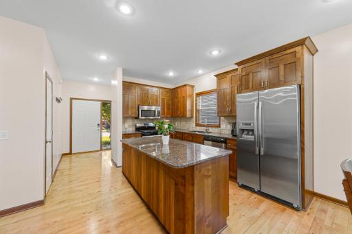 20_Kitchen with Alder cabinetry, granite counters, and center island.jpg