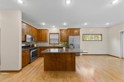 17_Kitchen with Alder cabinetry, granite counters, and center island.jpg