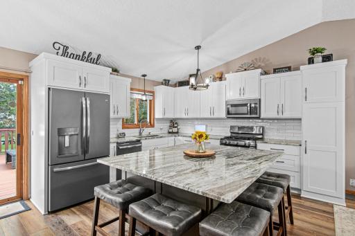 Beautifully remodeled kitchen features granite countertops, soft close cabinets and stainless steel appliances.