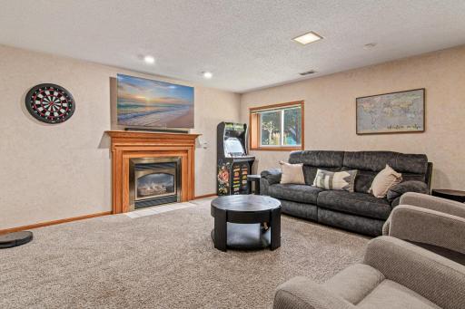 Cozy up to the fireplace in the spacious lower level family room