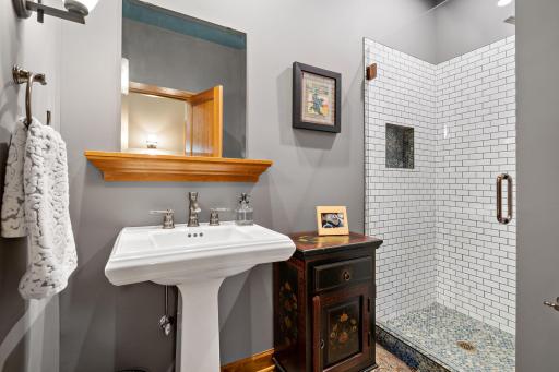 Upgraded tile shower on the main floor bathroom.