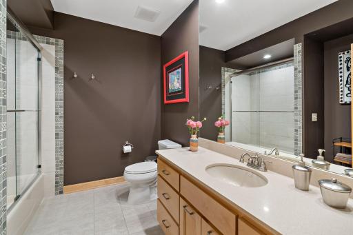 Tiled floor and shower in the lower level area.