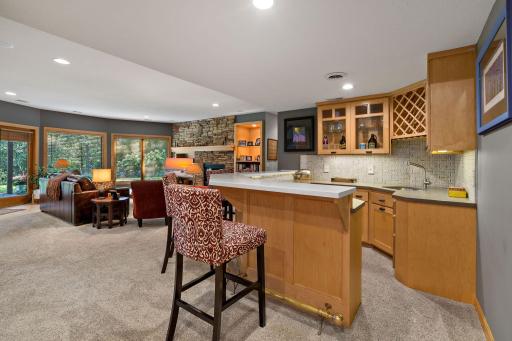 Wet bar has full backsplash tile and upgraded wet bar.