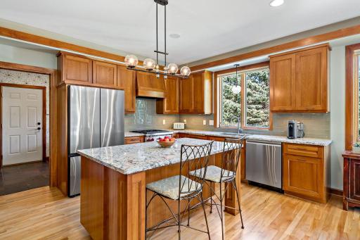 Kitchen is neutral with plenty of space for cooking and entertaining. Above the cabinets is additional accent lighting. There is water filtration system throughout the home.