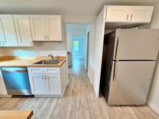 Kitchen with view of dishwasher and fridge.jpg