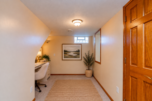 Cozy office nook under the stairs! Virtual staging.