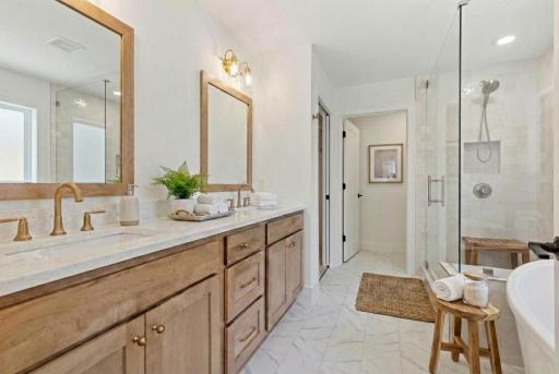 The Primary ensuite with beautiful tile work and 3cm quartz counters! *Photos are from a prior model-Majority of shown options are included in the sales price.