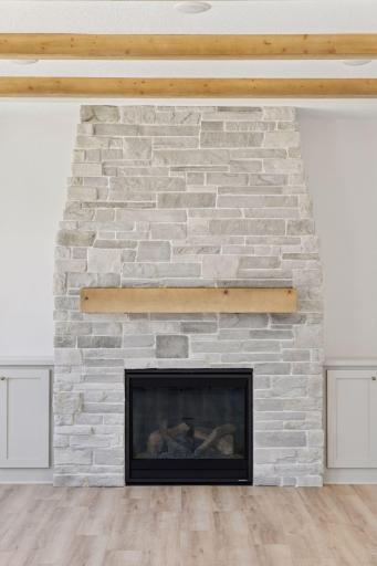 Beautiful Heat & Glo Gas fireplace with floor to ceiling stone and floating wood mantel! *Photos are from a prior model-Majority of shown options are included in the sales price.