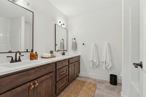Full bathroom with dual sinks, and 3cm counters! *Photos are from a prior model-Majority of shown options are included in the sales price.Virtually staged to show design options.