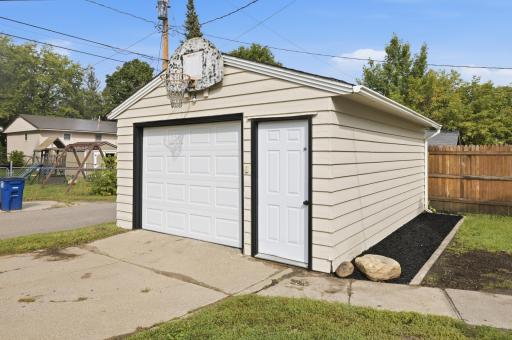 One car garage is accessible from the alley