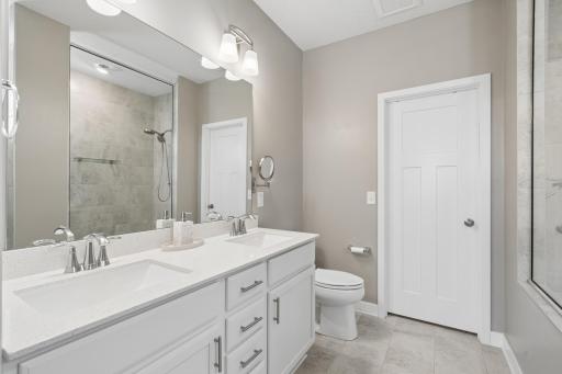 Spacious and bright with double sinks, modern fixtures, and a large mirror â designed for convenience and style.