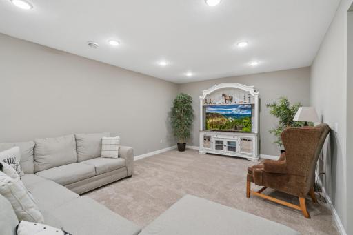 Expansive Basement Recreation Area Open-concept layout with plush carpeting