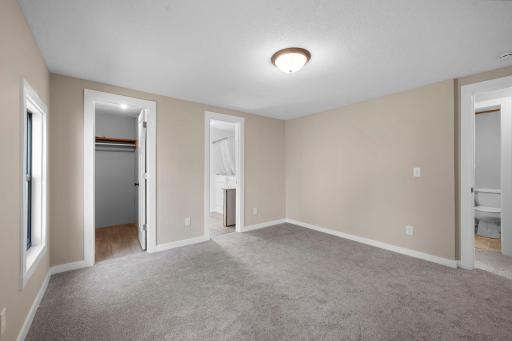 Primary bedroom with ensuite bath and walk in closet