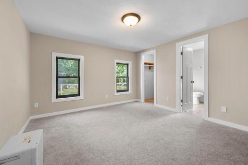 Primary bedroom with ensuite bath and walk in closet