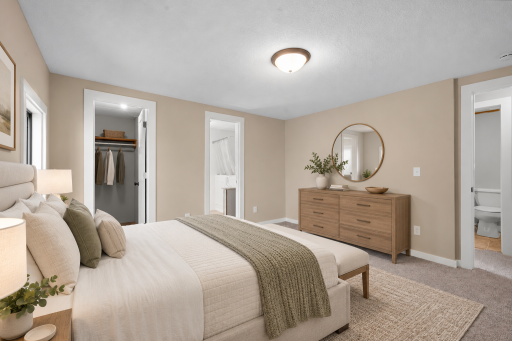 Primary bedroom with ensuite bath and walk in closet (Virtually Staged)