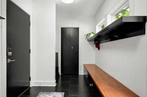 Large tiled mudroom off the kitchen