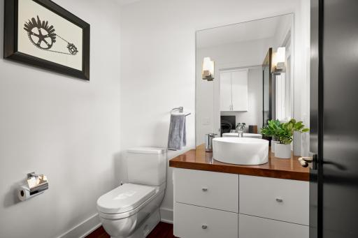 Main floor powder room with auto lights and shades