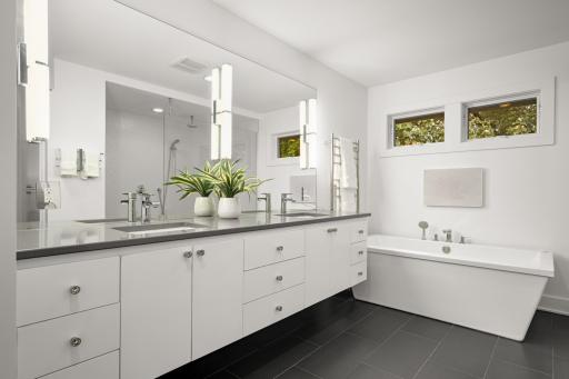 Spa-like primary suite with double vanities