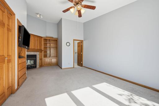 Vaulted ceilings elevate the owner's suite, creating a bright, open retreat that truly feels like your own private oasis.
