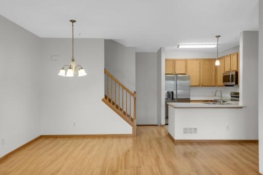 Light filled kitchen offering 9 ft ceilings. Dining room adjacent to kitchen and living room.