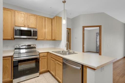 Open floor plan with ample counterspace and snack bar.