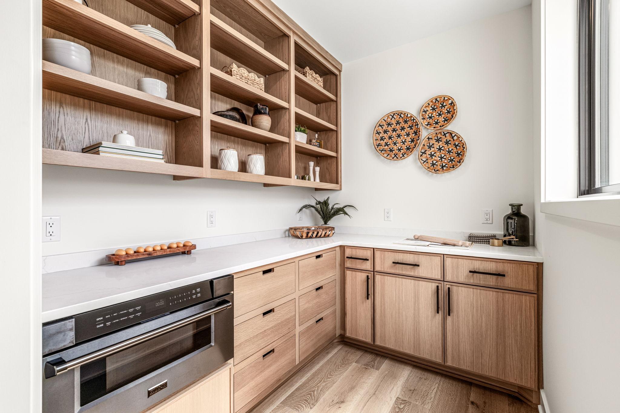 Walk-in butlers pantry with quartz countertops,