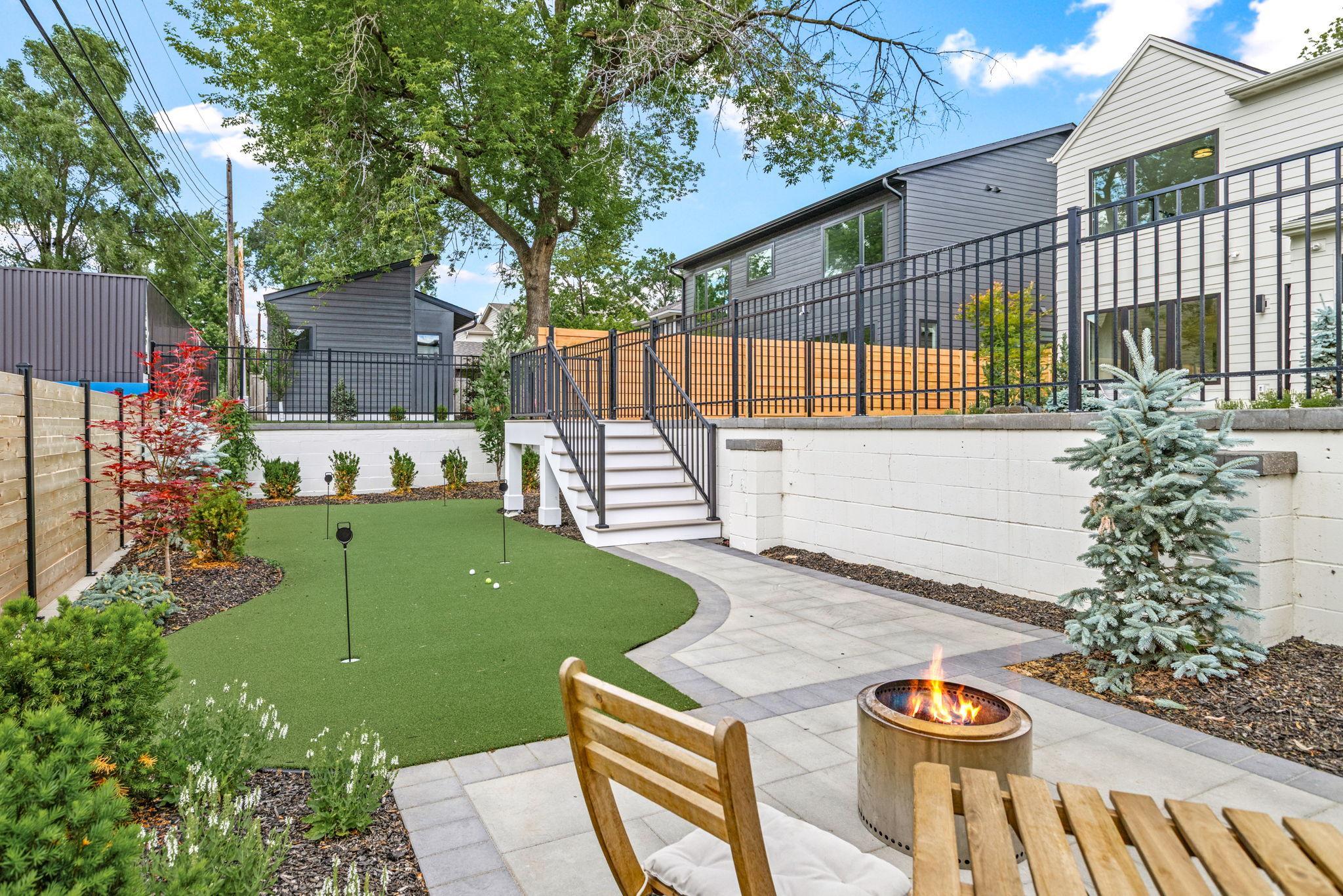 One of a kind lower terrace featuring a custom putting green and conversation patio!