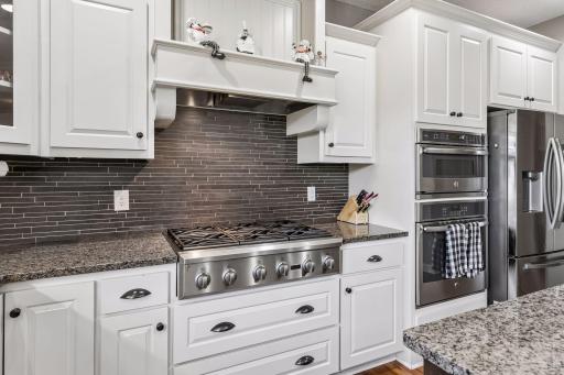 Commercial grade stove top and hood vent.